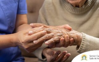 A care provider examines an older adult’s fingers, representing what would happen in an examination for rheumatoid arthritis.